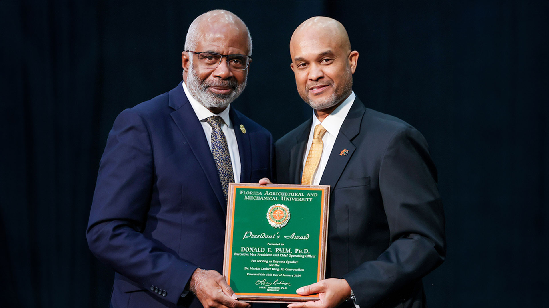 President Robinson presents EVP/COO Donald Palm with the President’s Award at 2024 MLK Convocation. (Credit: Glenn Beil) 