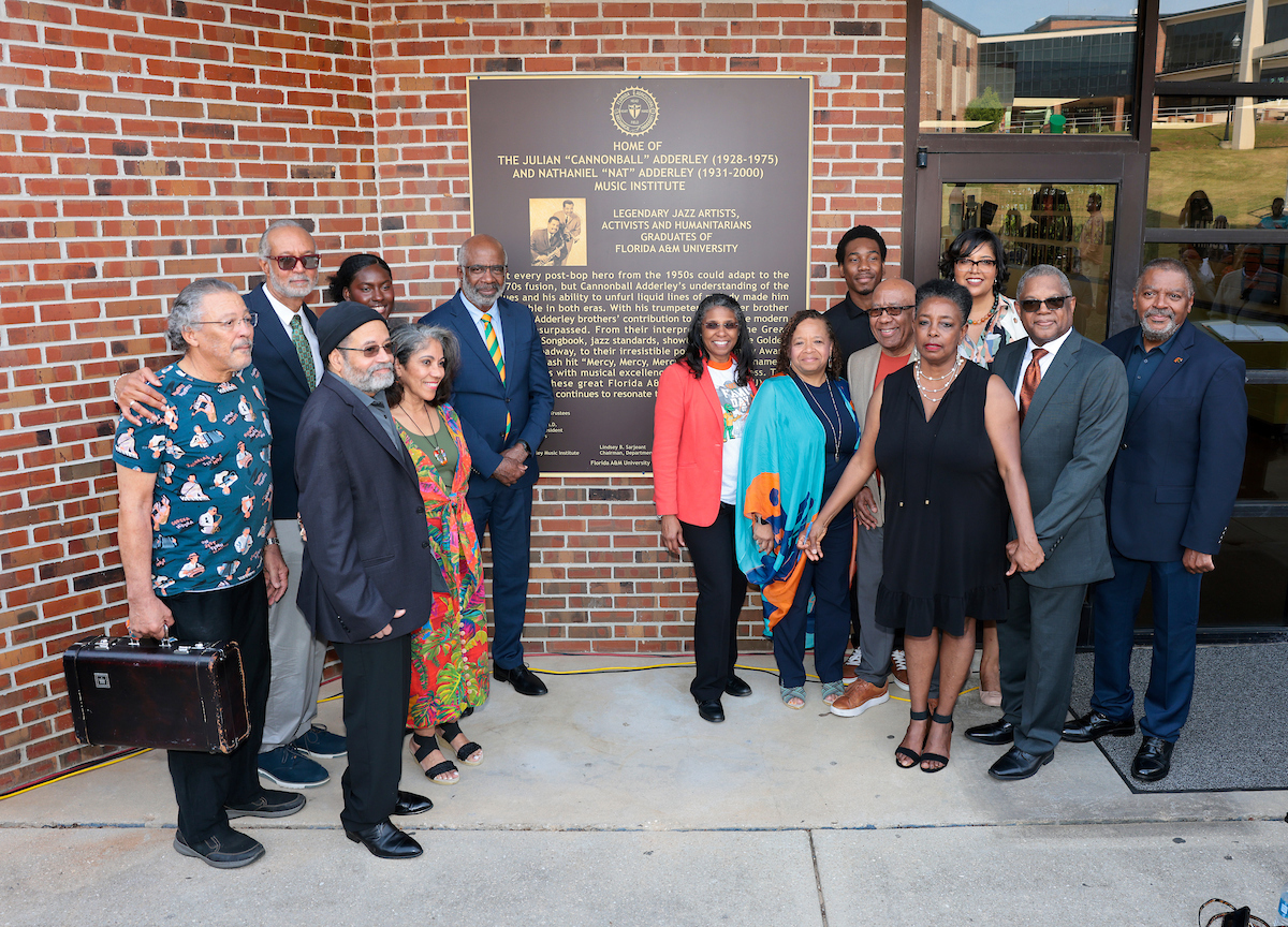 FAMU President Robinson is joined by CSSAH Dean Valencia Matthews, Nat Adderley’s daughter and son, Alison and Nat Jr., and others as the Julian “Cannonball” Adderley and Nathaniel “Nat” Adderley Music Institute plaque is unveiled on Thursday April 18, 2024.